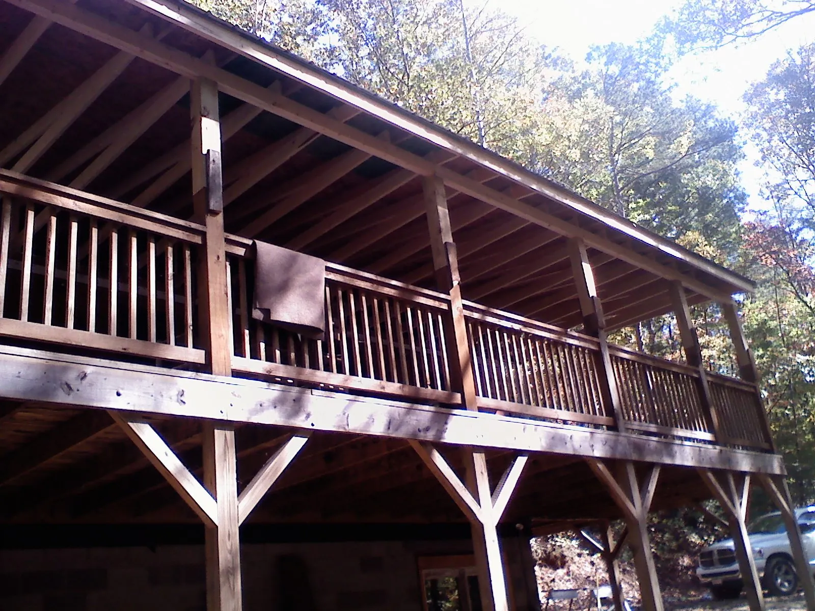 Timber framing under a new elevated porch and deck — Roof Leak Repair in Wellfleet by Roofing Brothers